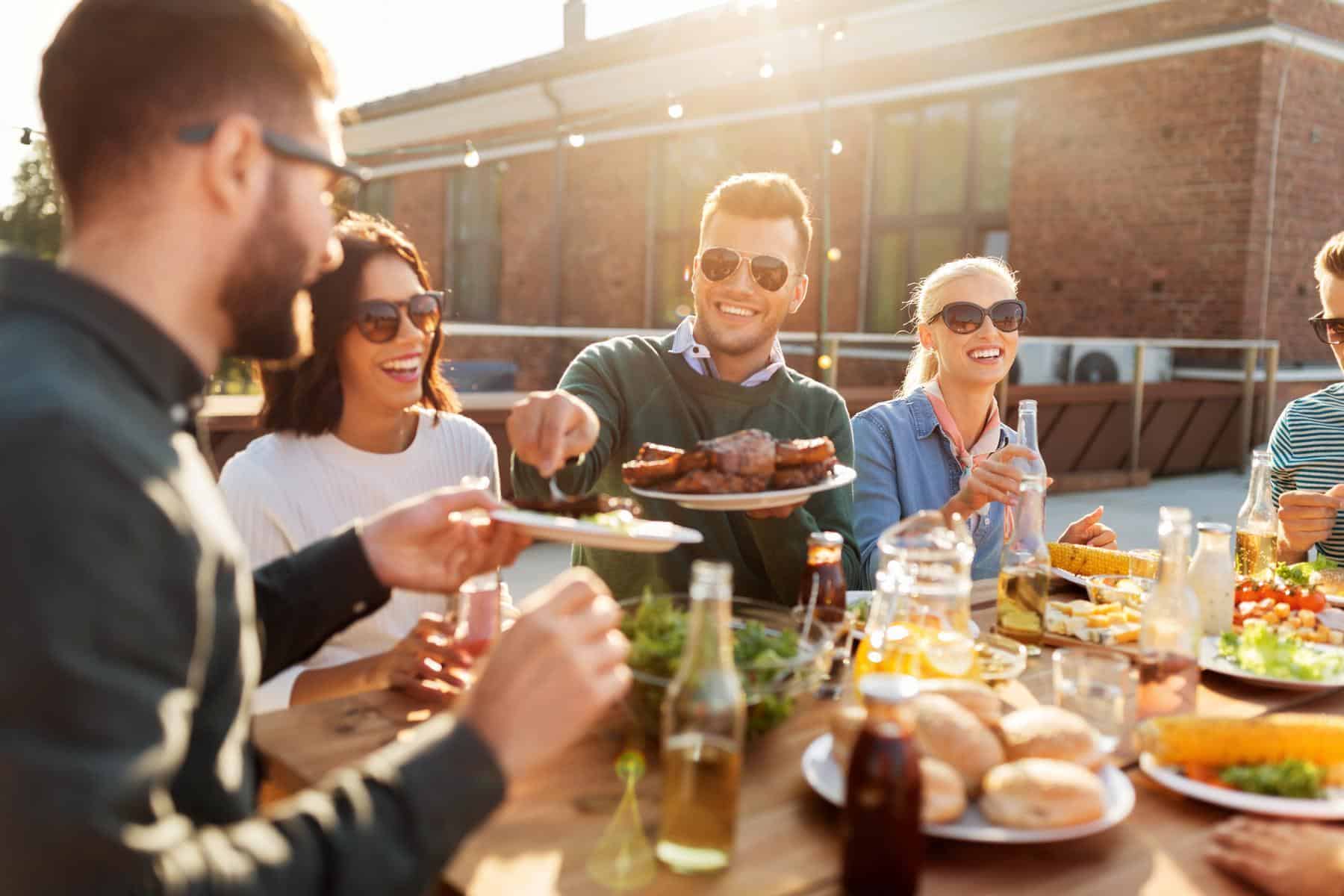 Friends enjoying dinner on a roof top